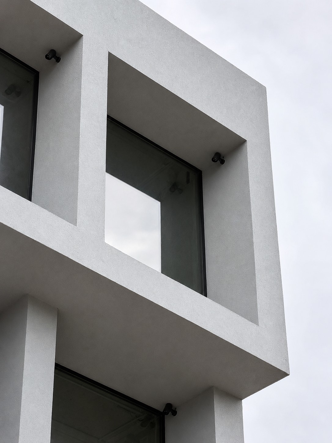 Architectural detail of slim minimal aluminium windows installed by Mparolas on the MOB1 commercial project.