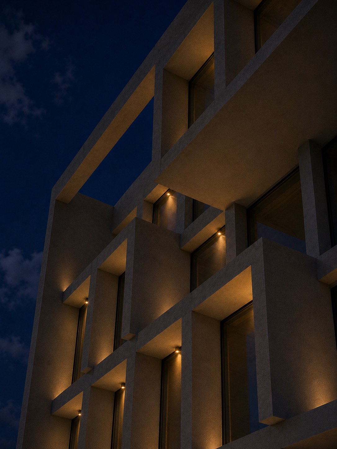 Modern aluminium façade with minimal windows illuminated at night, installed by Mparolas Aluminium Systems for the MOB1 project.
