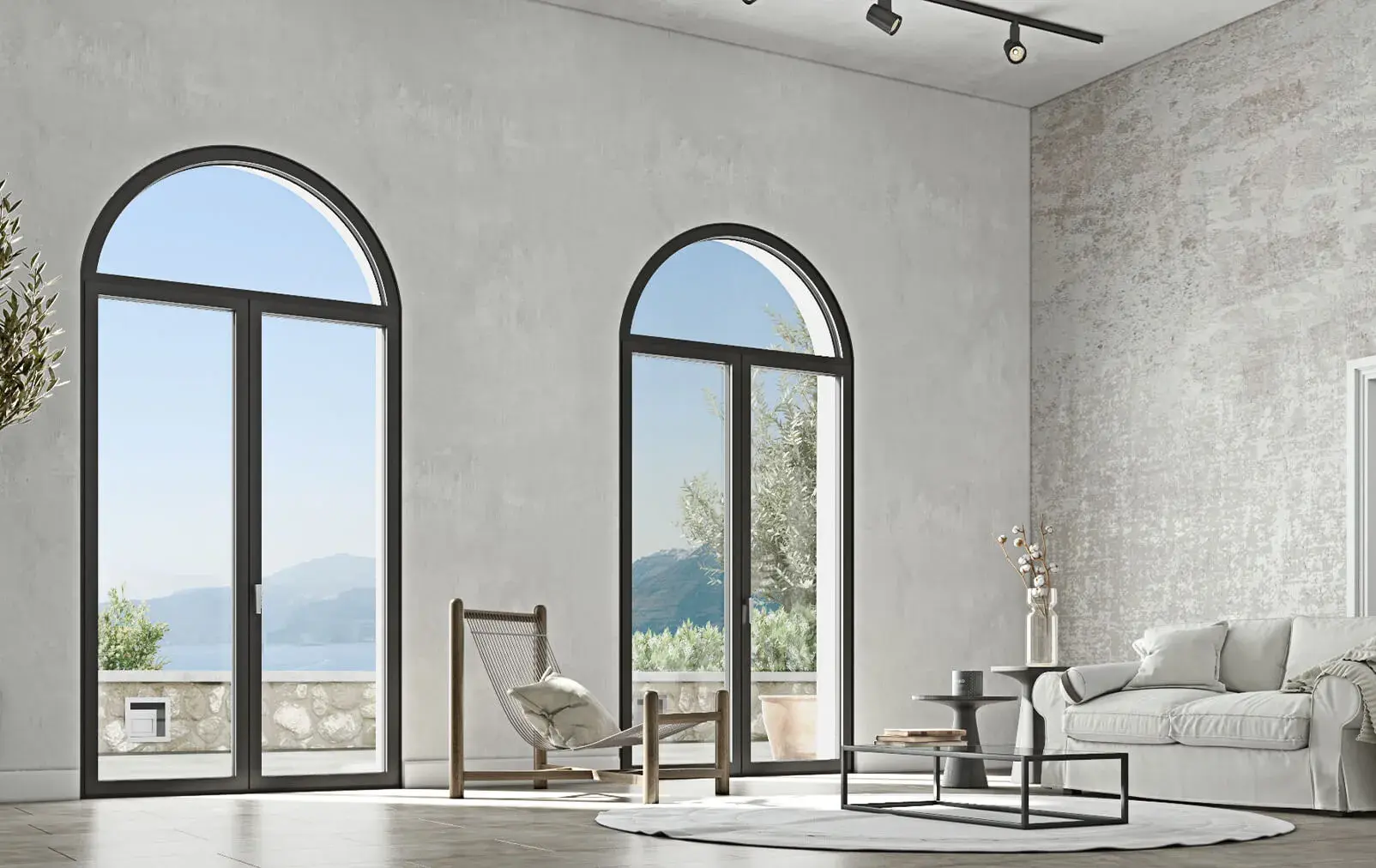 Modern living room featuring ELVIAL ICONIC W77 AI² aluminium windows with elegant arched design, slim frames and large glazed openings.