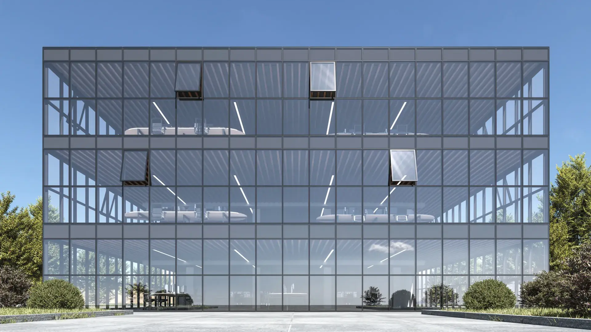 Modern commercial building featuring the ELVIAL FS50 aluminium curtain wall facade system with floor-to-ceiling glazing and slim aluminium profiles.