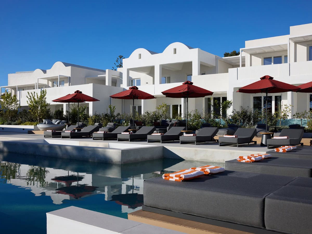 Luxury hotel exterior with aluminium windows overlooking the pool at Santorini Heart Hotel & Spa