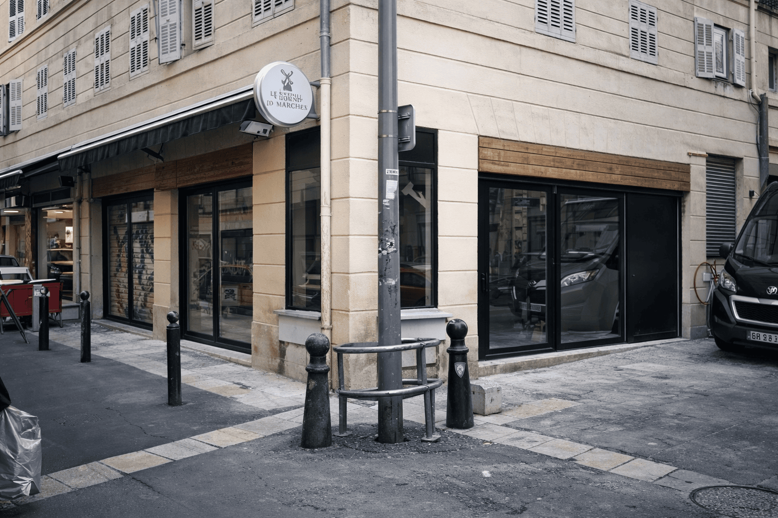 Black aluminium windows installed on commercial corner property in Marseille France