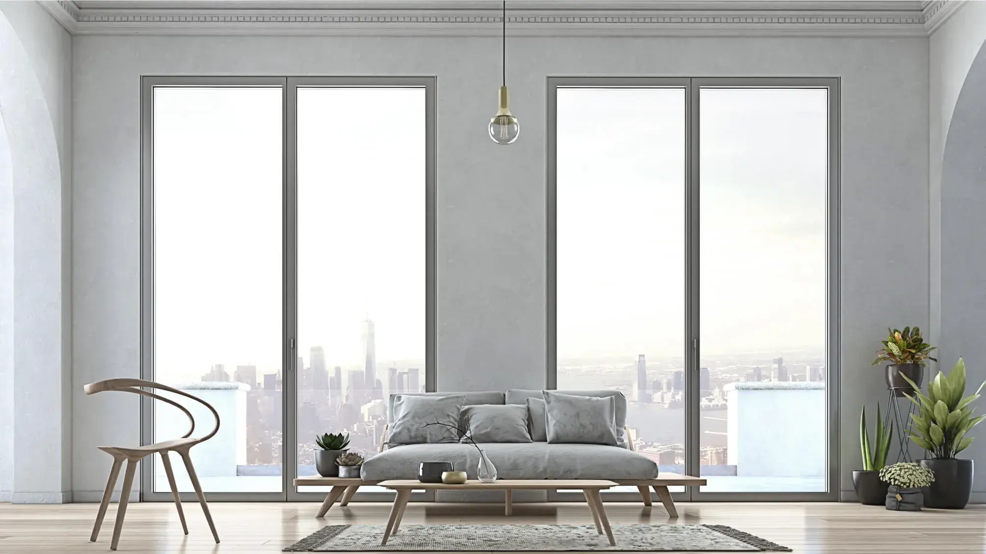 ELVIAL ICONIC W77 AI² aluminium windows with slim frames in a modern living room with panoramic city view