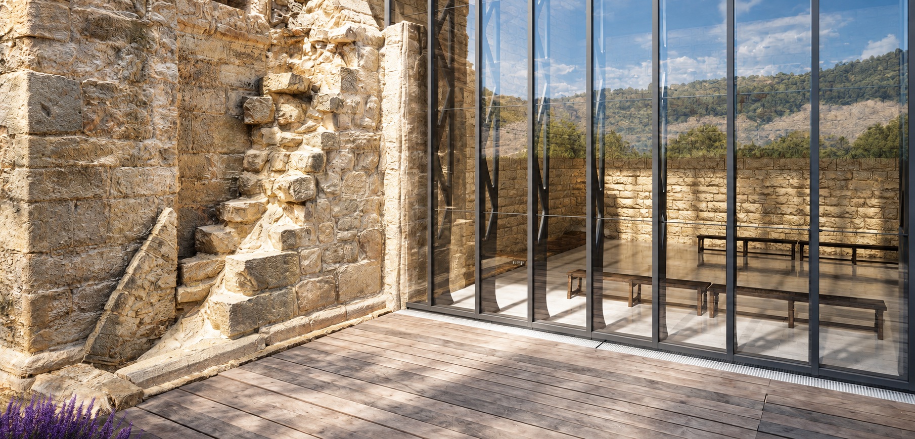 Forster Thermfix Light steel curtain wall system with slim profiles and large glazing integrated into a historic stone building